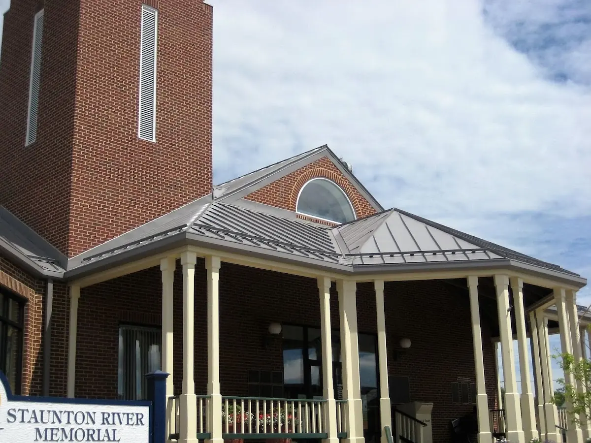 Skilled roofing craftsmen working on a residential roof in Tapleyville